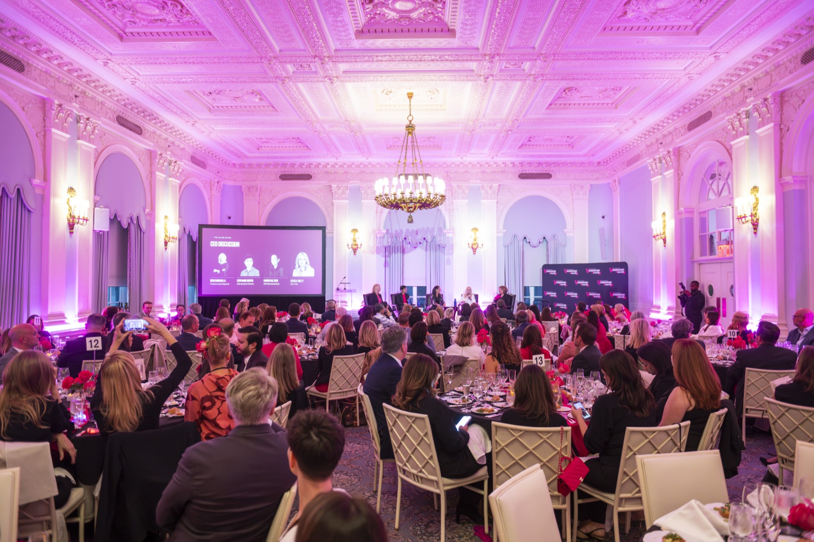 The Yale Club ballroom lit in pink for Revenue Room™ Salon 2026 dinner